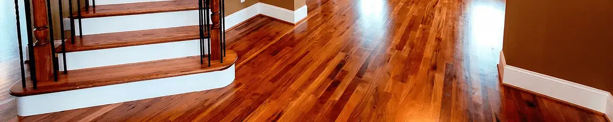 Base floor of a staircase with professionally restored wood flooring in Springfield MO
