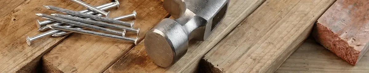 Hammer and nails on hardwood flooring boards in Springfield, MO